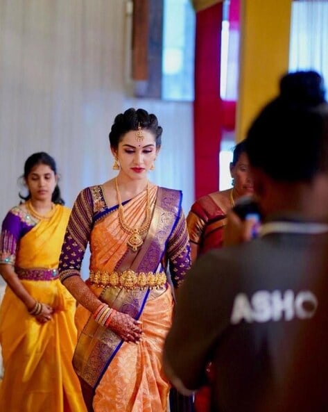 Indian woman wearing red orange saree jewellery choker set necklace jhumka  earring maang tikka waist chain stand pose look see smile mood expression  look Stock Photo | Adobe Stock