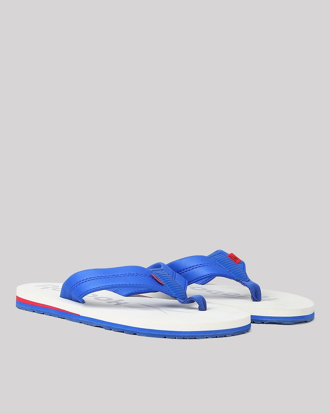 Buy White Flip Flop Slippers for Men by Reebok Online Ajio