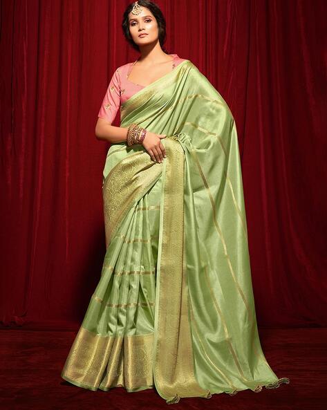 Pista Green Kanjivaram Silk Saree, a masterpiece that combines traditional  elegance with contemporary charm. - House of Surya