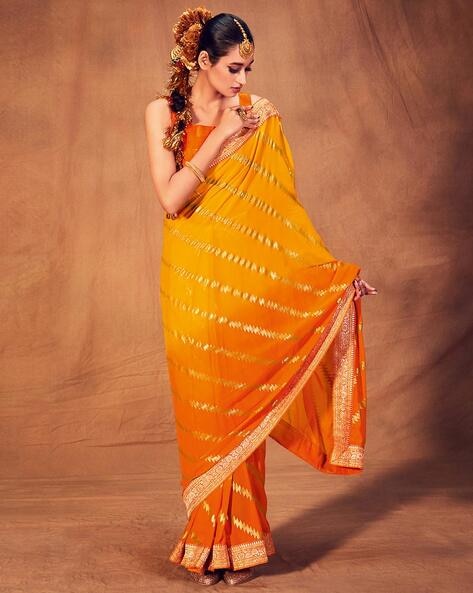 Orange saree with golden green border - Sri Kumaran Stores