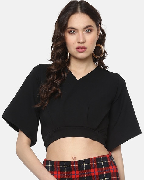 V-neck crop top with bell sleeves.