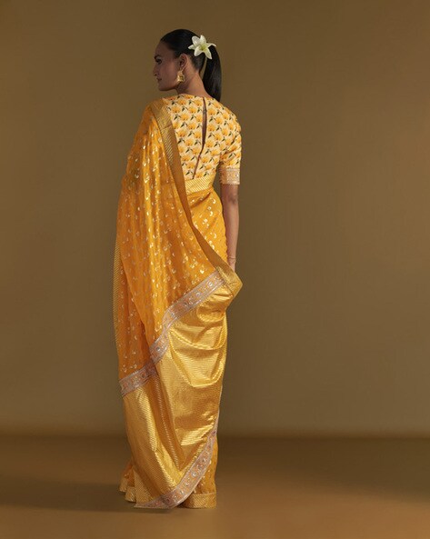 Mango yellow Kancheepuram silk saree, contrast korvai border with rekku,  ogee & chevron & pallu of intricate ogee design