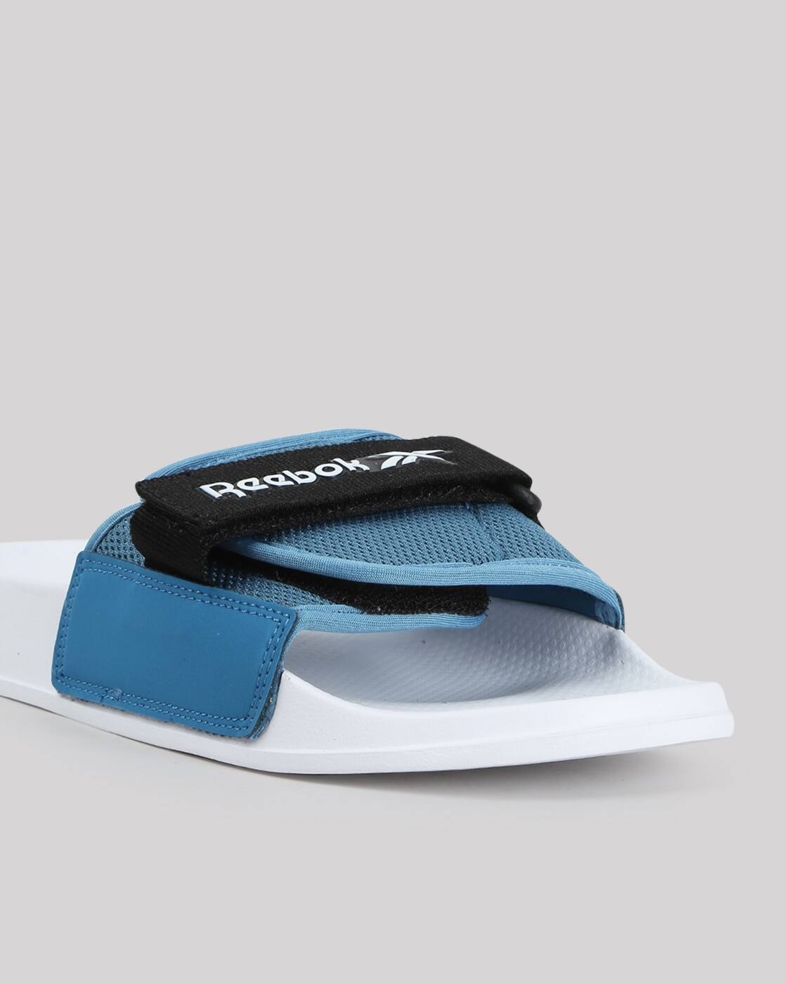 Buy Blue \u0026 White Flip Flop \u0026 Slippers for Men by Reebok Online | Ajio.com