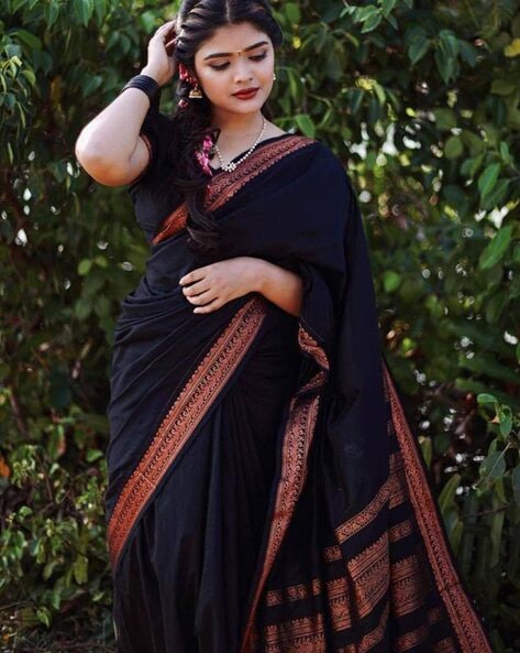 Nalli - This exquisite black soft silk saree adorned with... | Facebook