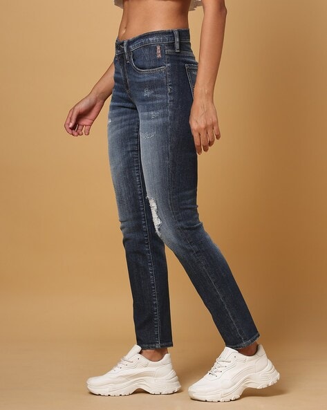 Mid rise destructed slim crop jeans