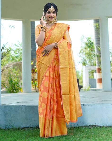 Cynosure Orange Soft Silk Saree With Demesne Blouse Piece -