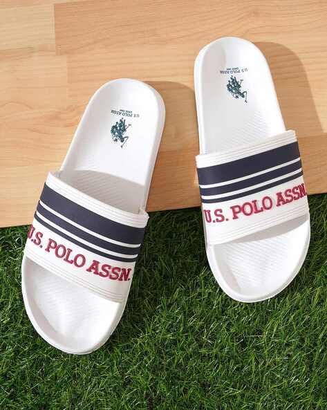 The white cheap brand slippers