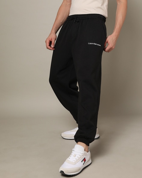 Buy Calvin Klein Jeans Men Black Solid Pure Cotton Joggers - Track Pants  for Men 16413180 | Myntra