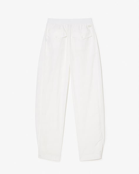 White lacoste track on sale pants