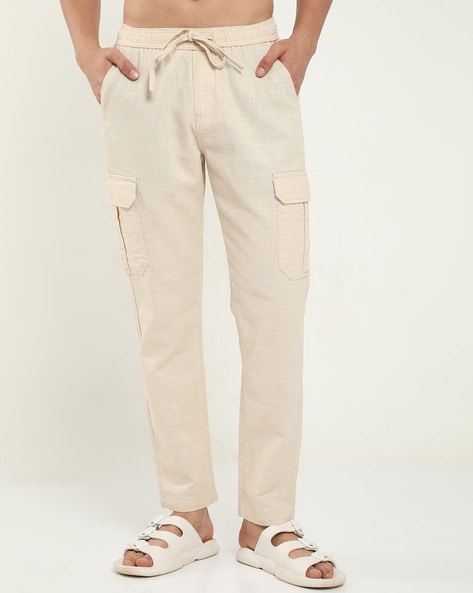 Buy Beige Trousers & Pants for Men by NEVER NEUD Online