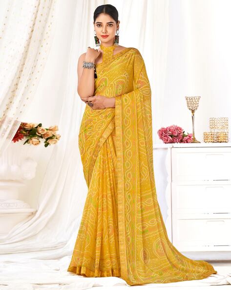 Red and yellow color bandhani saree with hand bandhej print