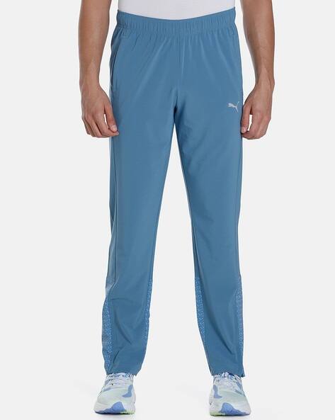 PUMA track pants blue × white Graphic Men's Slim Fit Track Pants | PUMA