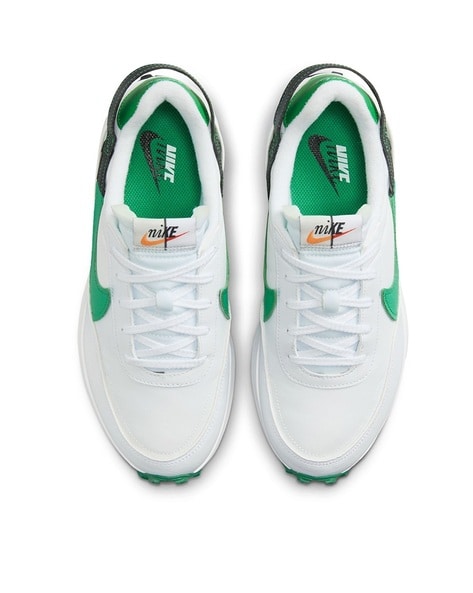 Nike outburst trainers in white sales and green