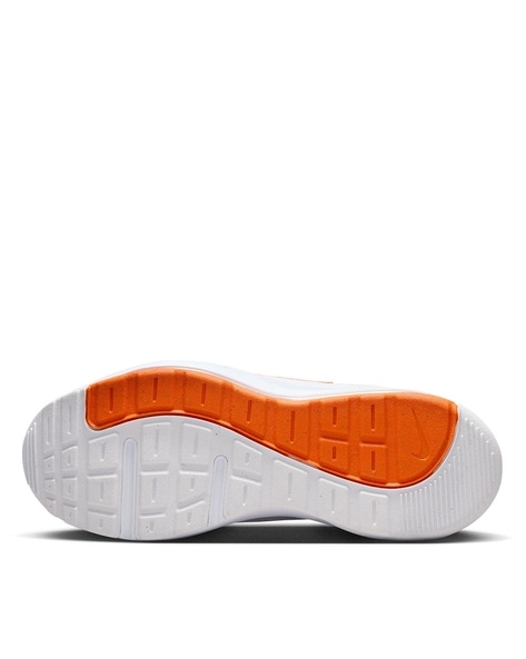 Orange and best sale white womens nikes