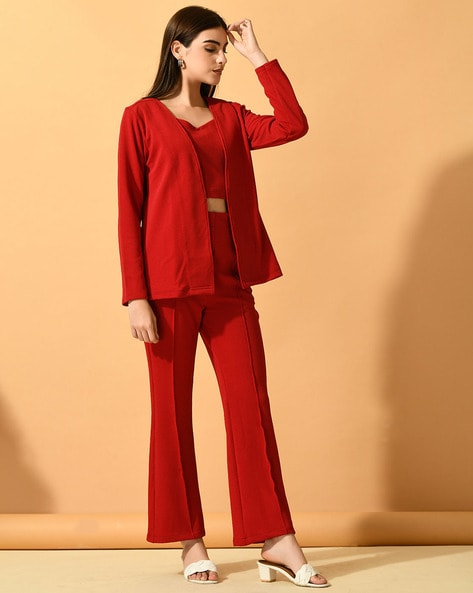 A Young Woman in a Red Trouser Suit and a Shiny Top Poses on a White  Background Stock Photo - Image of young, happy: 268866788
