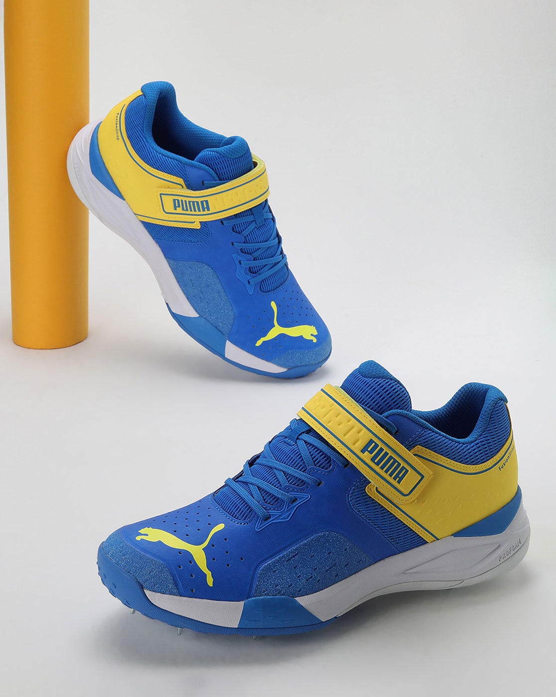 Puma blue and hot sale yellow trainers