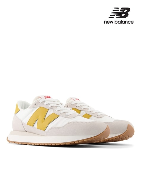 New balance yellow mens best sale