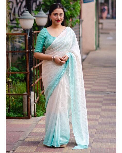 green sari | Party wear sarees, Designer blouse patterns, Saree blouse  designs