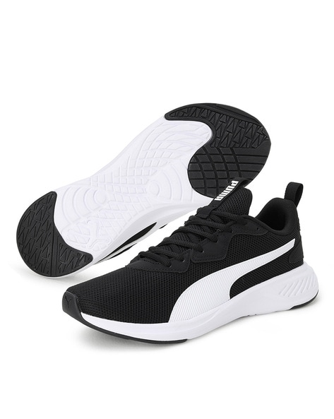 Puma black shoes store with white sole