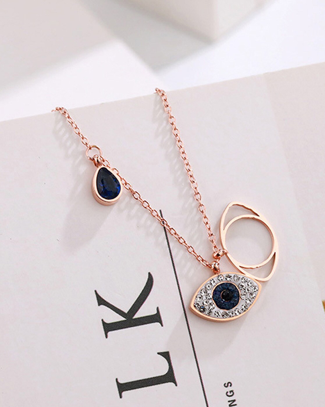 Swarovski Symbolic necklace, Moon, infinity, hand, evil eye and horseshoe,  Blue, Rose gold-tone plated by SWAROVSKI | Scarborough Town Centre