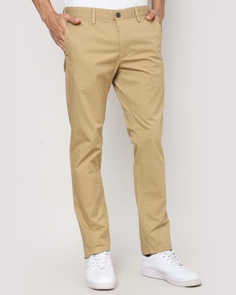 Buy Peter England Men Beige Solid Carrot Fit Casual Trousers online