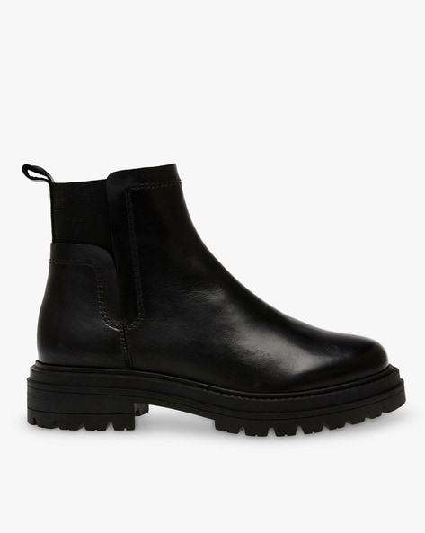 Steve madden black and gold boots on sale