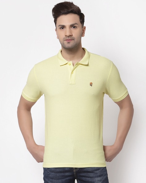 yellow shirt with red collar