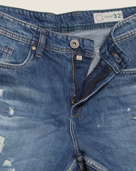 Loose-fit jeans with tears