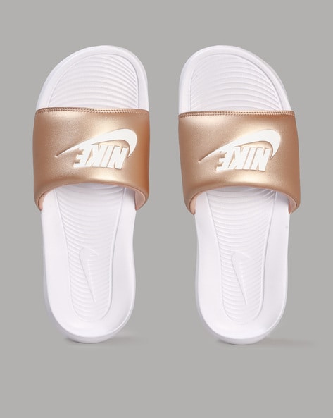 Nike slippers shop with gold logo