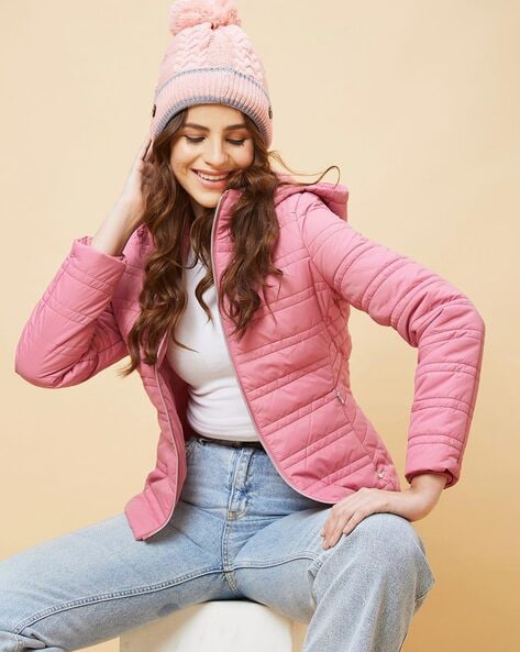 Fashionable little girl wearing cap, denim jacket and sneakers stock photo