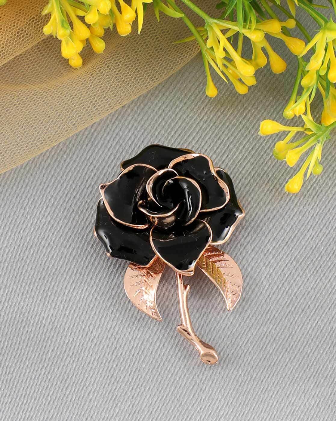 Black and store gold brooch