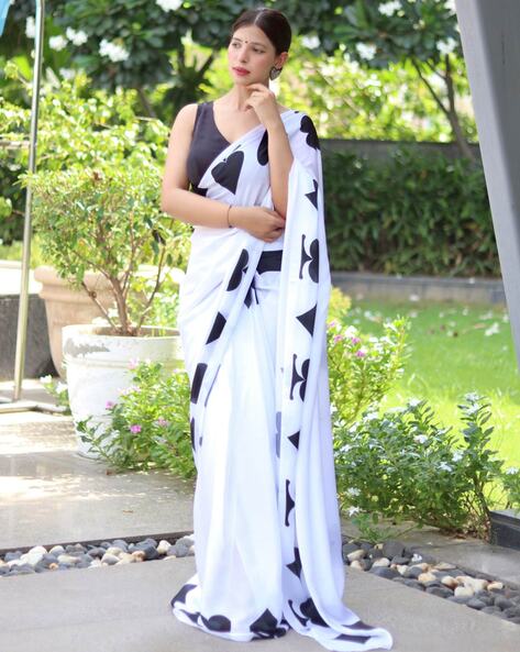 Purnaa looks pretty in a simple white saree!