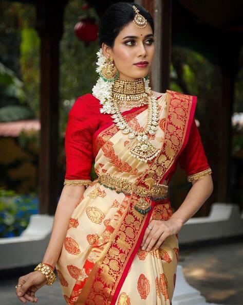 The elegance of a pure Banarasi Silk Saree with hand woven Mor bootas and  fine jewellery set in 22K gold with syndicate polki, rubies, em... |  Instagram