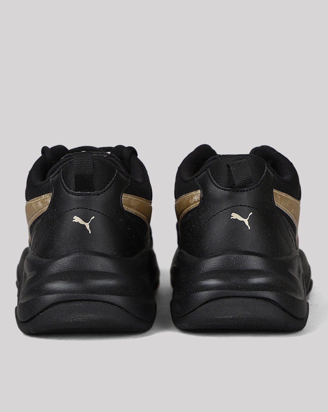 Black and gold outlet pumas vs america