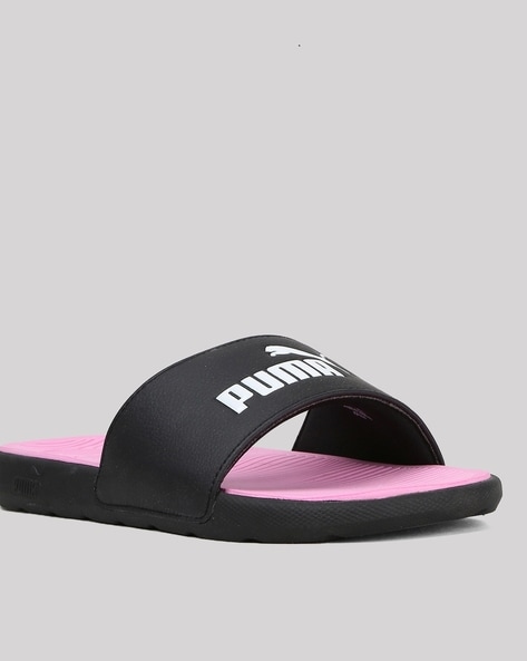 Black and store pink puma slides