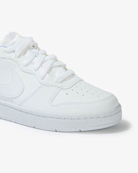 Black and white hot sale nike low tops