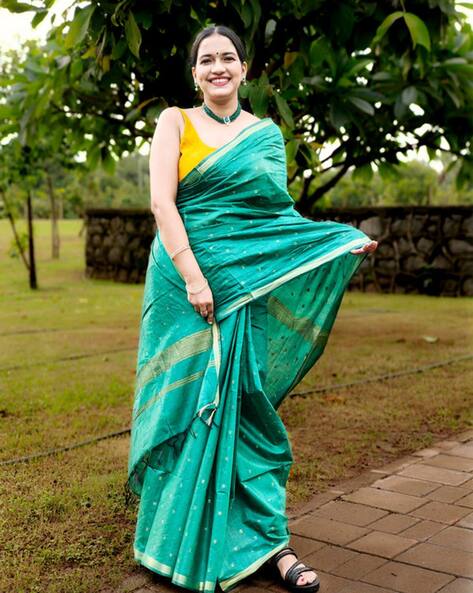 Buy green with anandha blue temple border saree