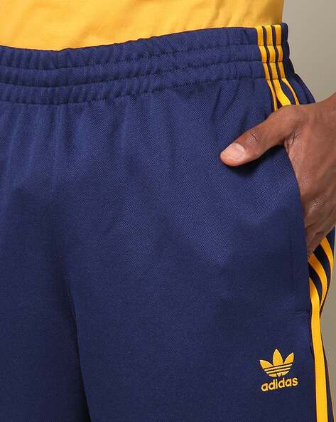 Blue and hotsell yellow adidas pants