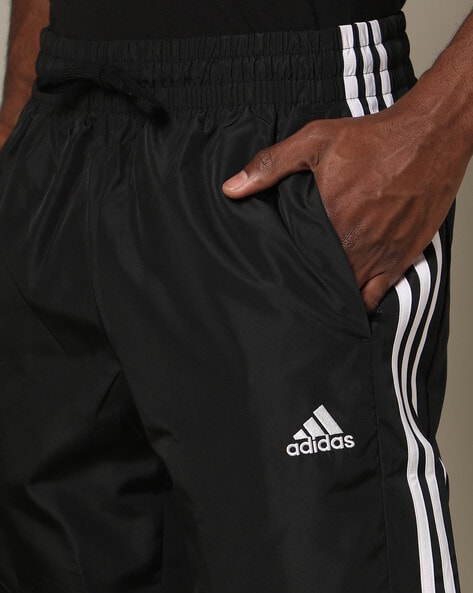 Adidas originals joggers with logo sales embroidery black