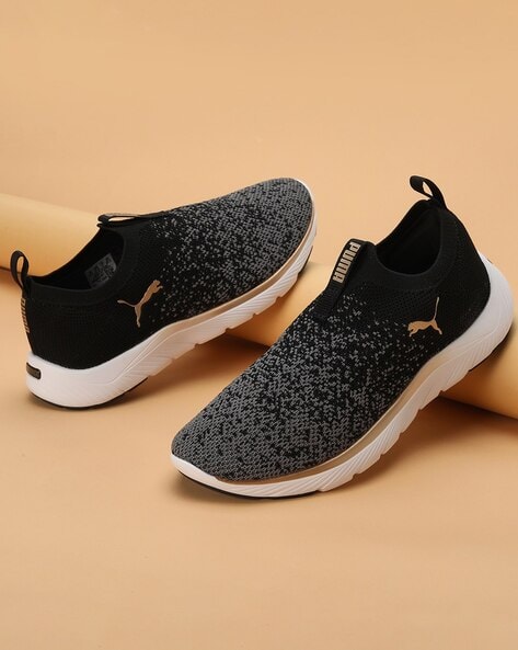 Puma black and on sale gold running shoes