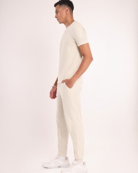 Buy online Men White Solid Regular Fit Track Pants from Sports Wear for Men  by Moonaah for ₹959 at 63% off | 2024 Limeroad.com