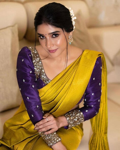 Let your beauty reflect with this beautiful mango yellow with purple  colored saree. Pair it with the perfect blouse piece… | Purple saree, Yellow  saree, Saree dress