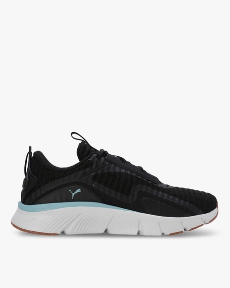 Puma defy black outlet trainers