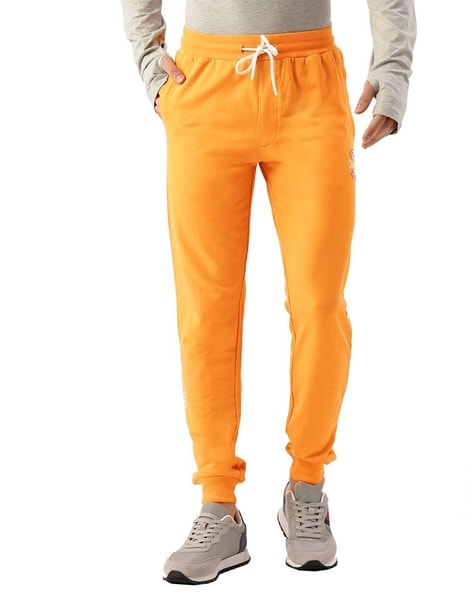 Orange store joggers mens