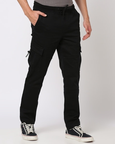 Nike Sportswear M NSW STE UTILITY - Cargo trousers - black/sail/ice silver/ black - Zalando.de