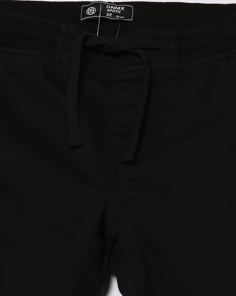 Buy Black Trousers & Pants for Men by DNMX Online
