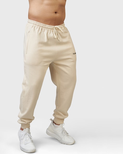 Buy Beige Track Pants for Men by FUAARK Online