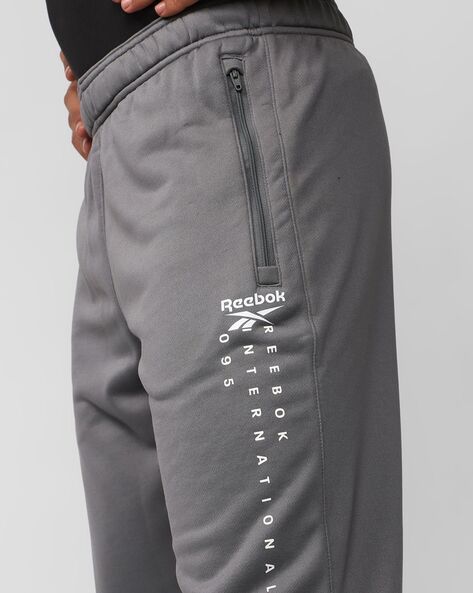 Buy Grey Track Pants for Men by REEBOK Online Ajio