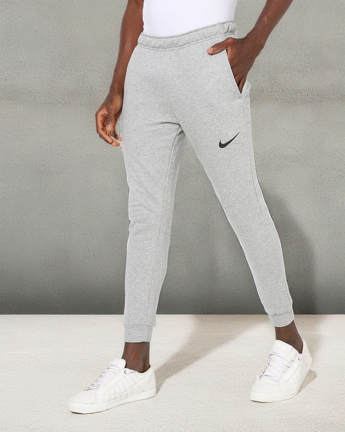 NIKE Dri-FIT Solid Women Black Track Pants - Buy NIKE Dri-FIT Solid Women  Black Track Pants Online at Best Prices in India