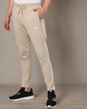 beige adidas track pants